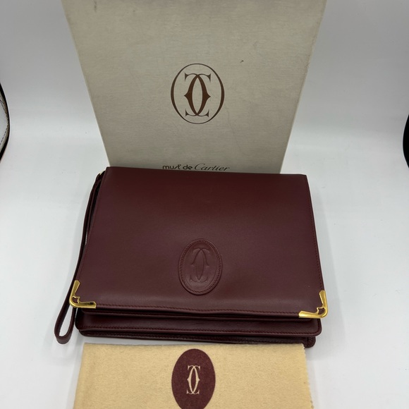 Cartier Handbags - Cartier Bordeaux Leather Clutch Wristlet